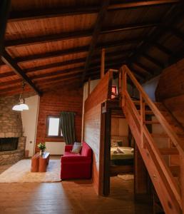 a room with a bunk bed and a red couch at Τετραπολις Wellness Farm 