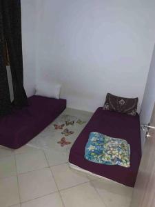 Katil atau katil-katil dalam bilik di Apartment mhamide 9 Marrakech