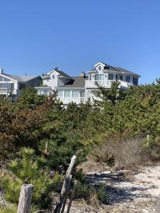 a house sitting on top of a sandy beach at 866 Rogers in Waretown