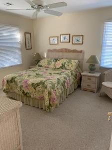 a bedroom with a bed and a ceiling fan at 866 Rogers in Waretown +20 photos