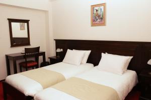 Voodi või voodid majutusasutuse Hotel Bohemia toas