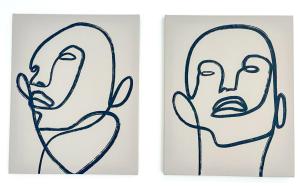 two framed illustrations of a face at Les Bouleaux YourHostHelper in Cagnes-sur-Mer