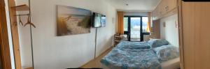 a small room with a bed in the middle of it at Panoramahaus in Bad Reichenhall