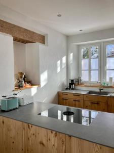 a kitchen with a sink and a counter top at Ravenna Lodge in Breitnau