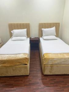 Una cama o camas en una habitación de Sport Hotel