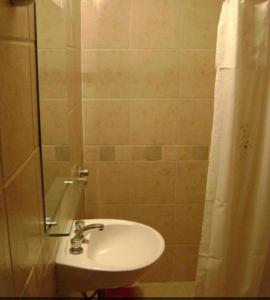 a bathroom with a sink and a shower at Hotel Rivamar in Mar del Plata