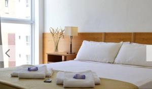 En eller flere senge i et værelse på Hotel Rivamar + 13 billeder