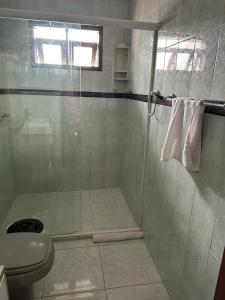 a bathroom with a shower with a sink and a toilet at Hotel Costa Dalpiaz in Torres