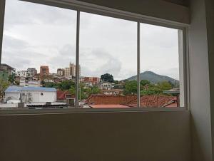 a window in a room with a view of a city at Apartamento central en Cali, Colombia 302 in Cali