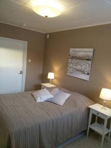 Ένα ή περισσότερα κρεβάτια σε δωμάτιο στο GuestHouse Ikimetsä