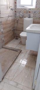 a bathroom with a toilet and a sink at Nasr city Cozy Studio _ 2 bedrooms in Cairo
