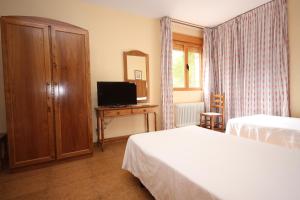 TV a/nebo společenská místnost v ubytování Hotel Rural Montaña de Cazorla