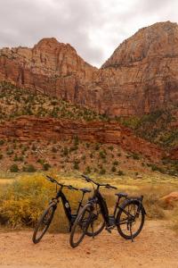 two bikes parked on a dirt road in a canyon at Zion on the 9 in Virgin