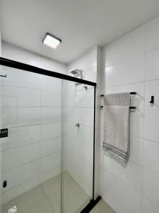 a shower stall with a glass door in a bathroom at Studio Moderno Westfit in Mossoró