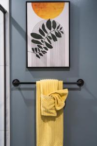 a towel hanging on a towel rack in a bathroom at The Relyn in Inglewood