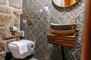 a bathroom with a sink and a toilet at Hebi house in Acre +190 photos