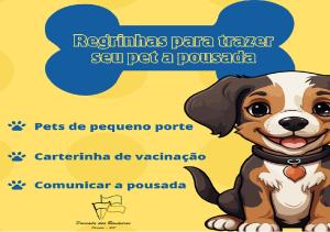 奧林匹亞的住宿－Pousada das Bandeiras，一张照片,上面写着“飞鹰号”字的狗把小狗从小狗身上转移。