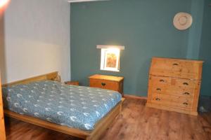 Una cama o camas en una habitación de Maison familiale Sud Drôme-Ardèche