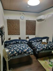 Postel nebo postele na pokoji v ubytování MIROKU Share House