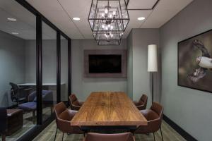 a conference room with a wooden table and chairs at Portland Sheraton at Sable Oaks in South Portland