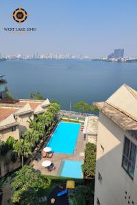 an overhead view of a swimming pool with a view of the water at Wil'que Westlake Hotel & Residences in Hanoi +106 photos