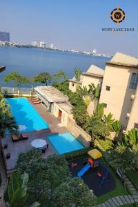 a swimming pool with a view of the water at West Lake 254D Hotel & Residence in Hanoi