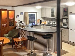 a kitchen with a large island in the middle at Holiday home Esbjerg V XI in Esbjerg