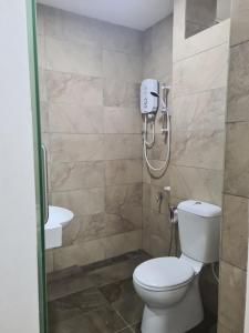 Koupelna v ubytování Nino Homestay Roxy Apartment Kuching