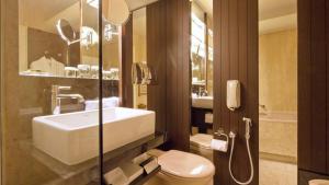 a bathroom with a sink and a toilet at InterContinental Genève by IHG in Geneva