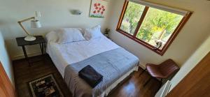 Cama o camas de una habitación en Hermosa Casa en Valdivia