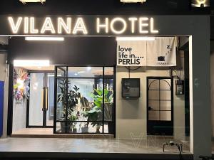 a hotel with a sign that reads villema hotellove like theim permits at Vilana Hotel in Arau
