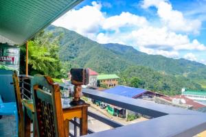 a balcony with a view of a mountain at BANAUE EVERGREEN HOSTEL AND RESTAURANT in Banaue