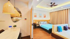 a hotel room with two beds and a table at FLC SEA TOWER QUY NHƠN Ưu Đãi Khủng Ngay Hôm Nay in Quy Nhon