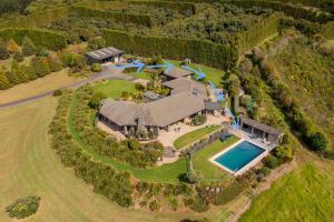 an aerial view of a large estate with a swimming pool at Country Retreat in Cooks Beach