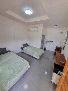 Photo de la galerie de l'établissement แกนล่อน เฮ้าส์, à Ban Rai Khlong Sai