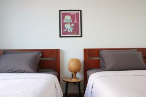 Sorya Guesthouse & Dolphin Tours客房内的一张或多张床位