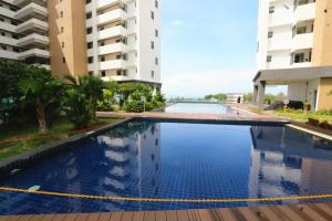 an empty swimming pool in the middle of a building at PD 4 Bedrooms Duplex - Full Seaview (Up to 16 Pax) in Port Dickson