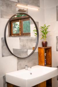 a bathroom with a sink and a mirror at Dream Villa - Tangalle in Tangalle