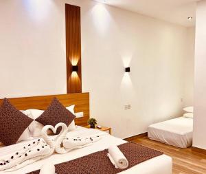 Postel nebo postele na pokoji v ubytování Kihaa Holiday Home