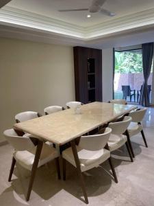 a dining room with a table and chairs at Villa by the Sea in Port Blair