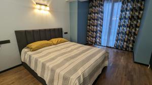 Postel nebo postele na pokoji v ubytování New Gudauri Alpine Charm apartments