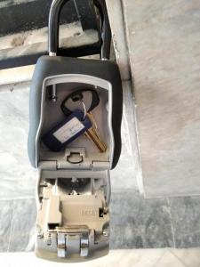 a suitcase with a pair of keys in it at CKBSM Athens Center Apartment 2 in Athens