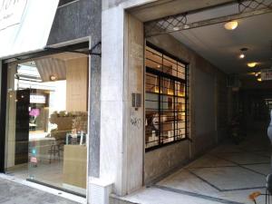 a store front with a glass door in a building at CKBSM Athens Center Apartment 2 in Athens