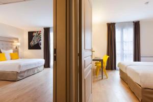 Hôtel Quality Suites Maisons-Laffitte Paris Ouest 객실 침대