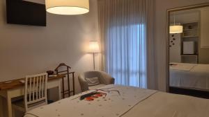 Posteľ alebo postele v izbe v ubytovaní Il Nido B&B