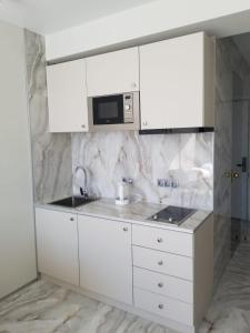 Kuchyň nebo kuchyňský kout v ubytování Segreto apartment 309, 311, 341 + 24 fotografií