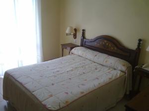 Posteľ alebo postele v izbe v ubytovaní Hotel Cortijo