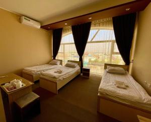 Ένα ή περισσότερα κρεβάτια σε δωμάτιο στο Safar ali hotel