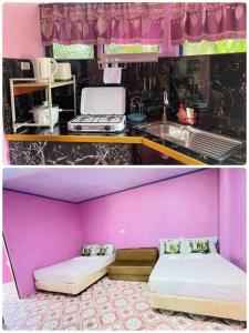 a pink kitchen with a bed and a sink at Einel Homestay 2 in Siquijor