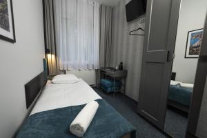 Posteľ alebo postele v izbe v ubytovaní Elegant Apartments
